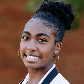 A Woman Smiling For The Camera