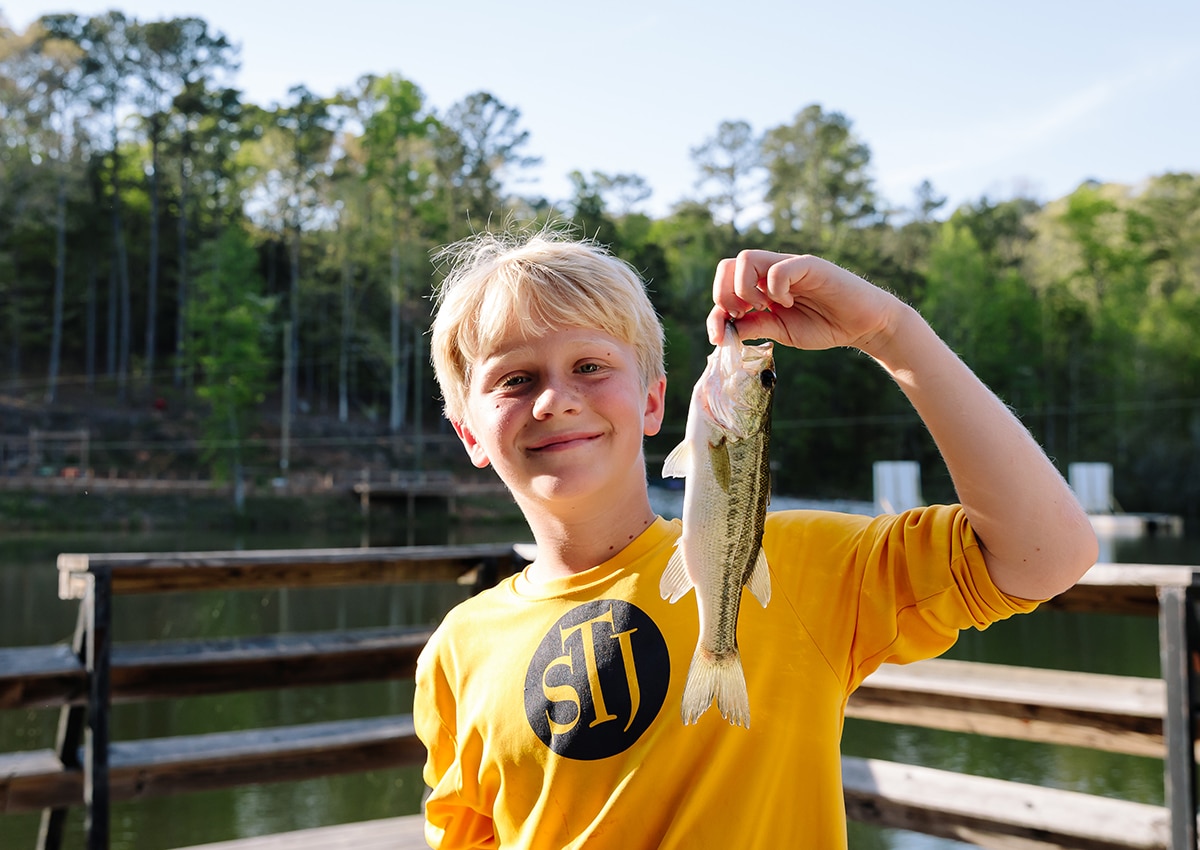 Boy Holding Fish Up