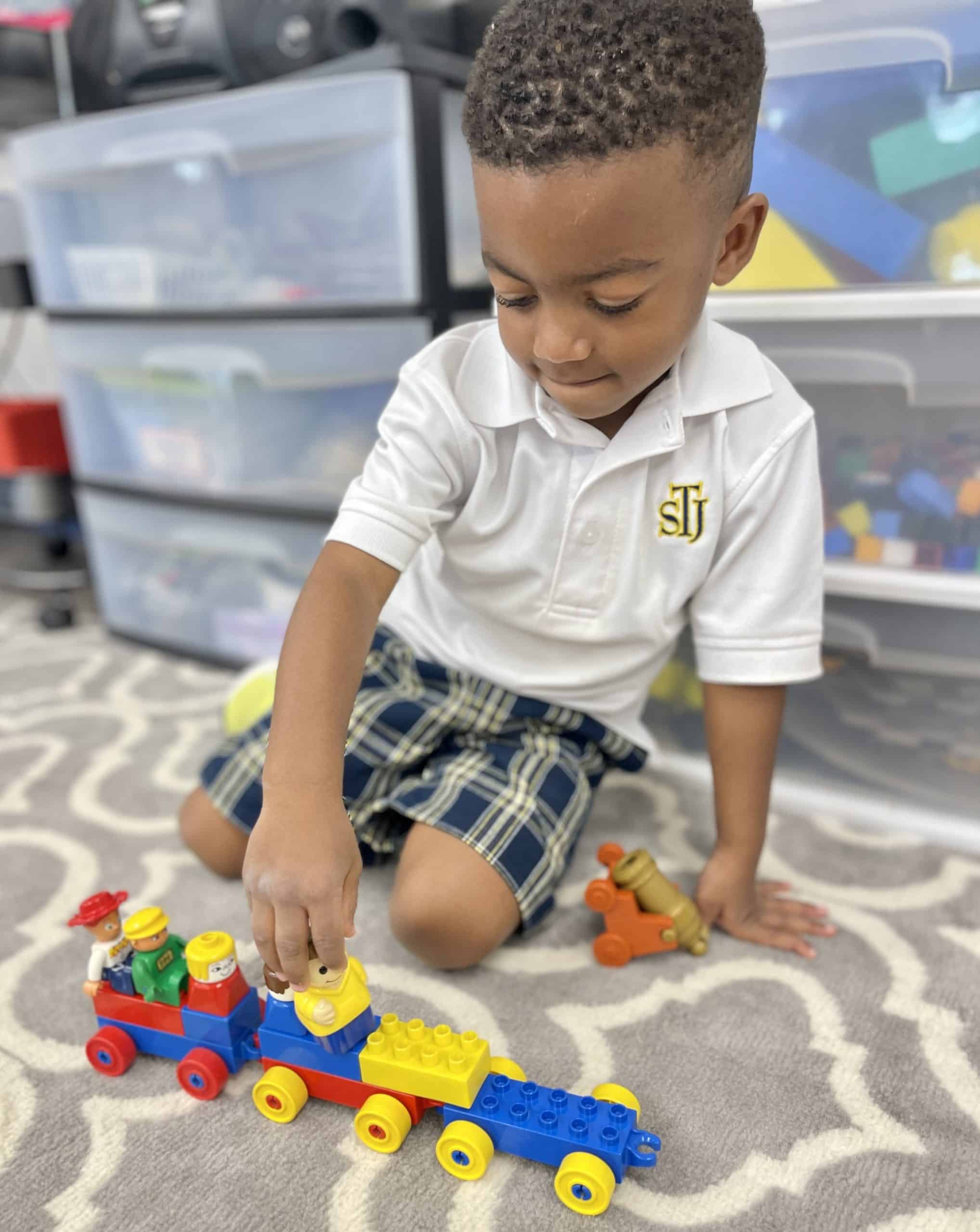 Pre-K Student Playing With Toys